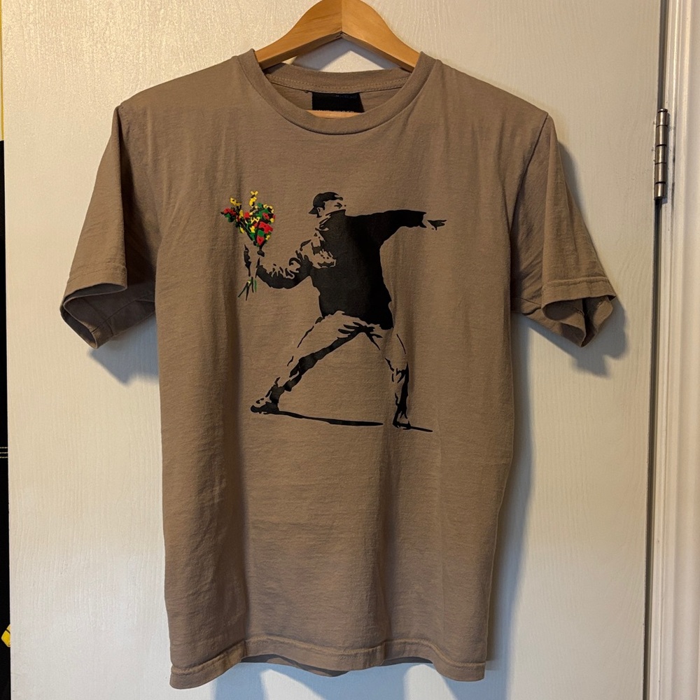 Banksy’s flower thrower Graphic Tee